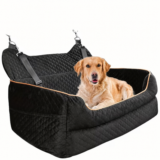 Golden Retriever sitting in a black quilted hammock-style dog car seat with orange trim