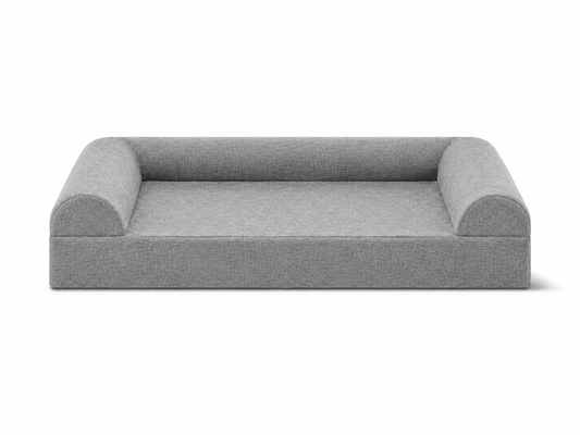 Front view of a gray three-sided sofa-style orthopedic dog bed